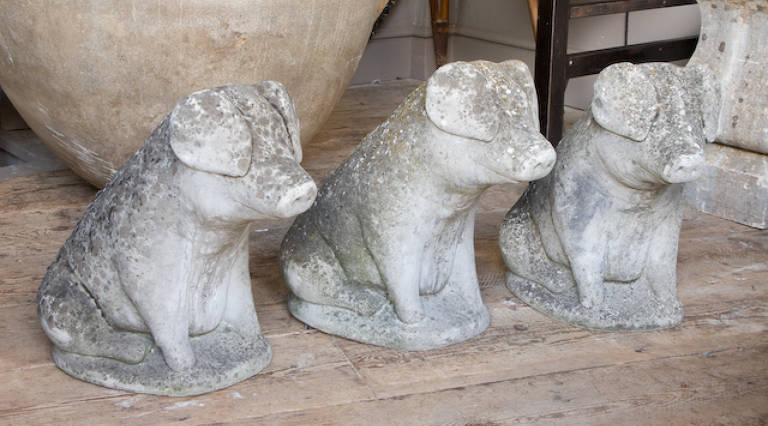 Three stone pigs