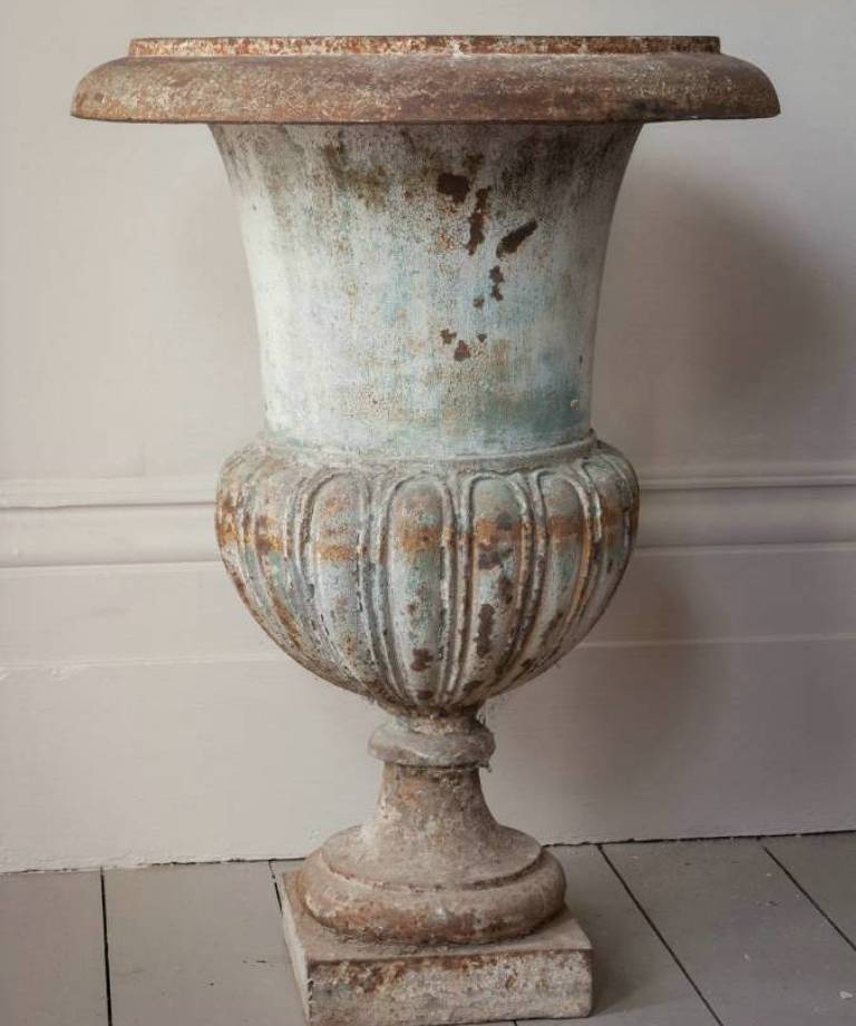 Pair of iron urns on stands