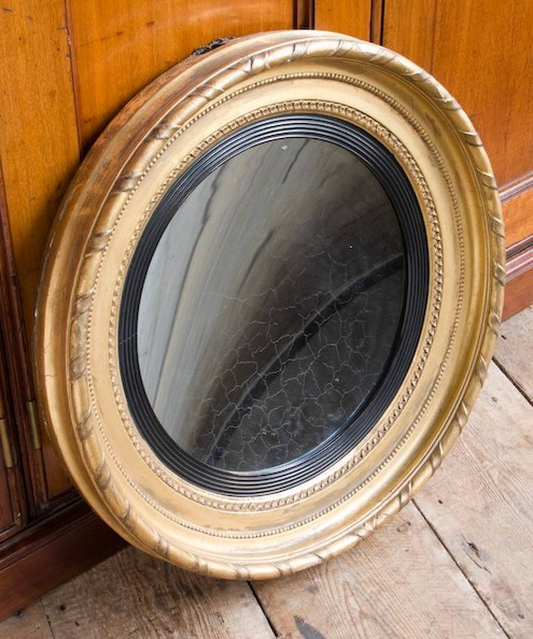 Gilded concave mirror