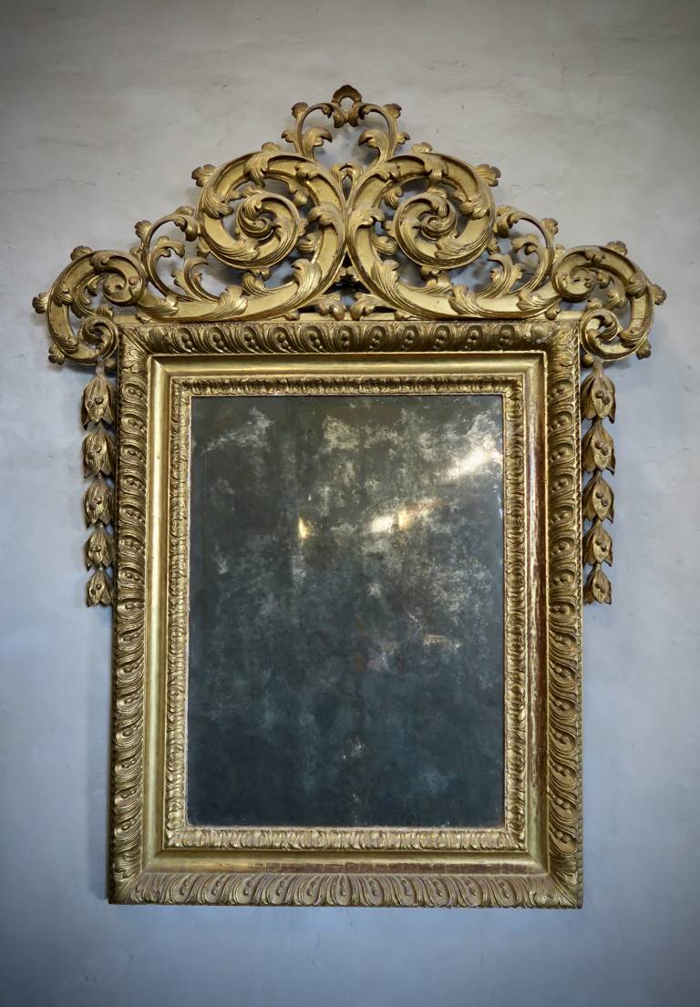 Carved giltwood mirror, circa 1740, Italy